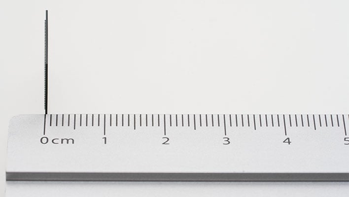 Side view of a Samsung LPDDR5X DRAM package on a ruler.